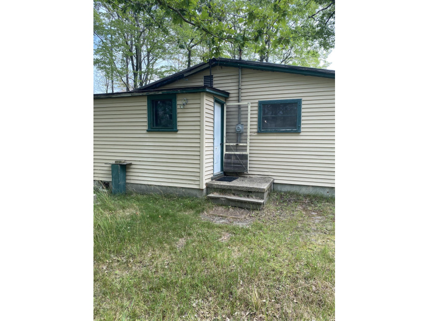 Tucked away at the end of a few two-tracks, this off-grid cabin - Beach Home for sale in Free Soil, Michigan on Beachhouse.com