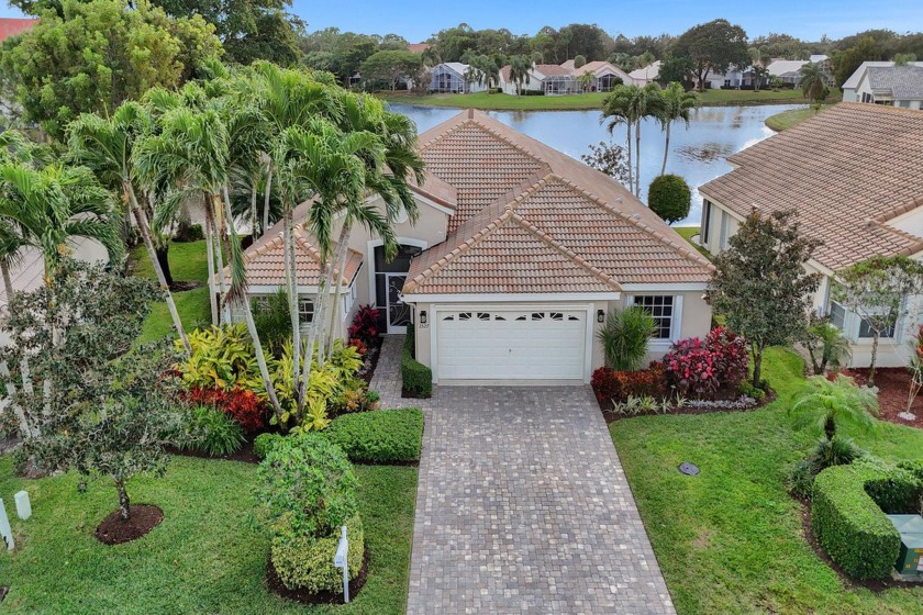 Captivating lake views adorn this exceptional home located in - Beach Home for sale in Greenacres, Florida on Beachhouse.com