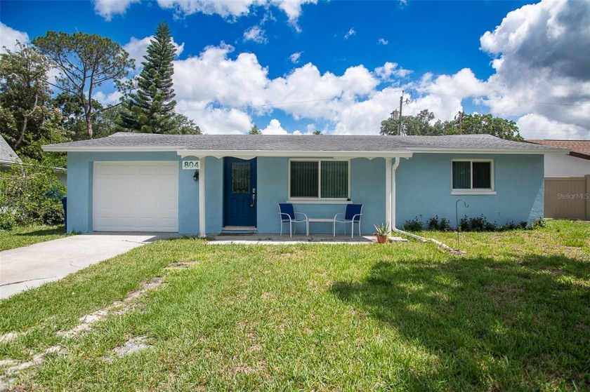 This delightful 3-bedroom, 2-bathroom home offers comfort and - Beach Home for sale in Dunedin, Florida on Beachhouse.com