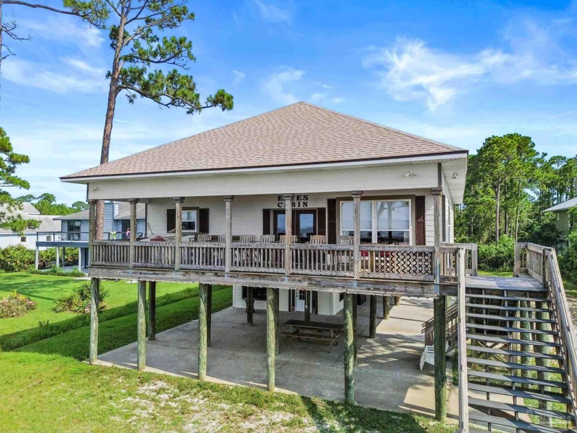 Come experience the true essence of bayfront living at this - Beach Home for sale in Pensacola, Florida on Beachhouse.com