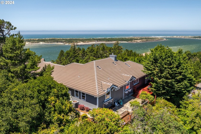 Welcome to your view home.  Nestled atop a private, landscaped - Beach Home for sale in Florence, Oregon on Beachhouse.com