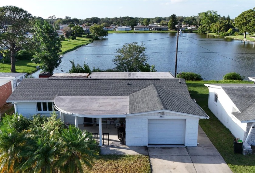 GORGEOUS LAKEFRONT Furnished HOME in Holiday Gardens! This home - Beach Home for sale in Holiday, Florida on Beachhouse.com