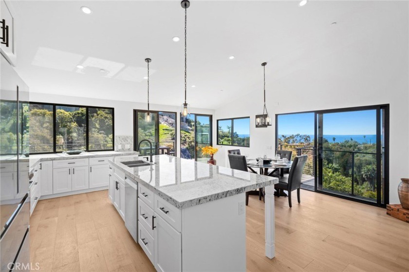 Embraced by a beautiful setting with ocean and canyon views on a - Beach Home for sale in Laguna Beach, California on Beachhouse.com