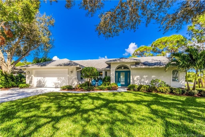 This beautifully remodeled 3/2 CBS home with impact glass boasts - Beach Home for sale in Palm City, Florida on Beachhouse.com