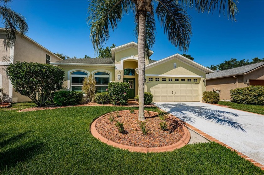 READY FOR IMMEDIATE OCCUPANCY!  Stunning landscaping frames this - Beach Home for sale in Oldsmar, Florida on Beachhouse.com