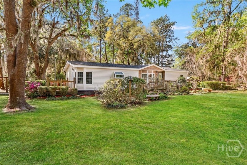 Nestled on a serene .57 acre wooded lot just a stone's throw - Beach Home for sale in Midway, Georgia on Beachhouse.com