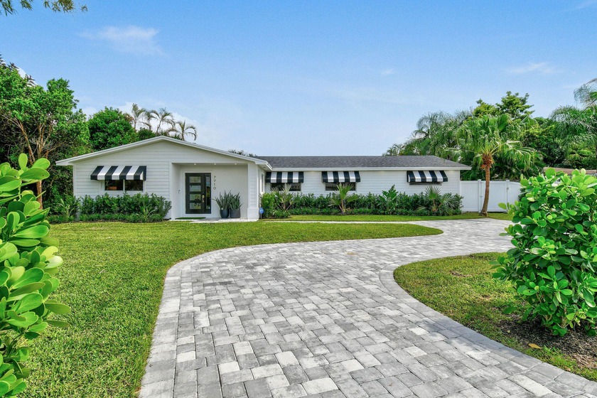 This completely remodeled 2024 masterpiece offers five bedrooms - Beach Home for sale in Lake Clarke Shores, Florida on Beachhouse.com