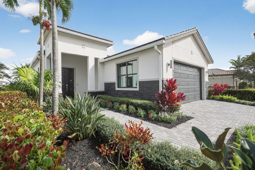 Nestled within a prestigious gated golf community, this - Beach Home for sale in Port Saint Lucie, Florida on Beachhouse.com
