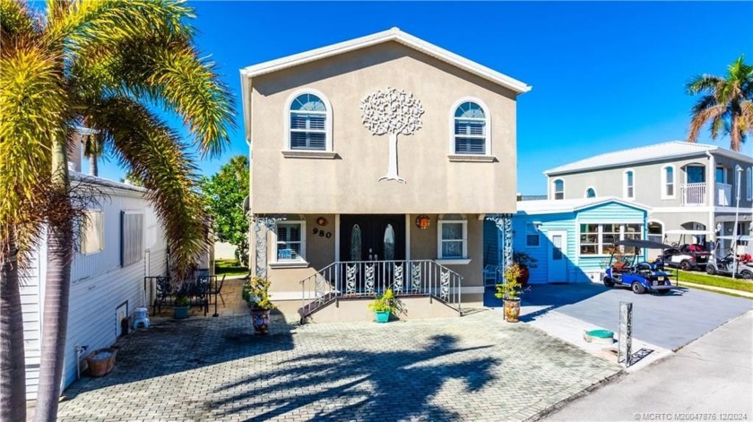 This residence boasts a spacious, open-concept design, perfectly - Beach Home for sale in Jensen Beach, Florida on Beachhouse.com