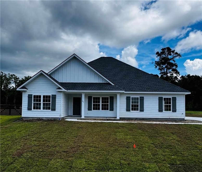 GORGEOUS NEW CONSTRUCTION ON THE LAKE IN BEAUTIFUL GATED - Beach Home for sale in Brunswick, Georgia on Beachhouse.com