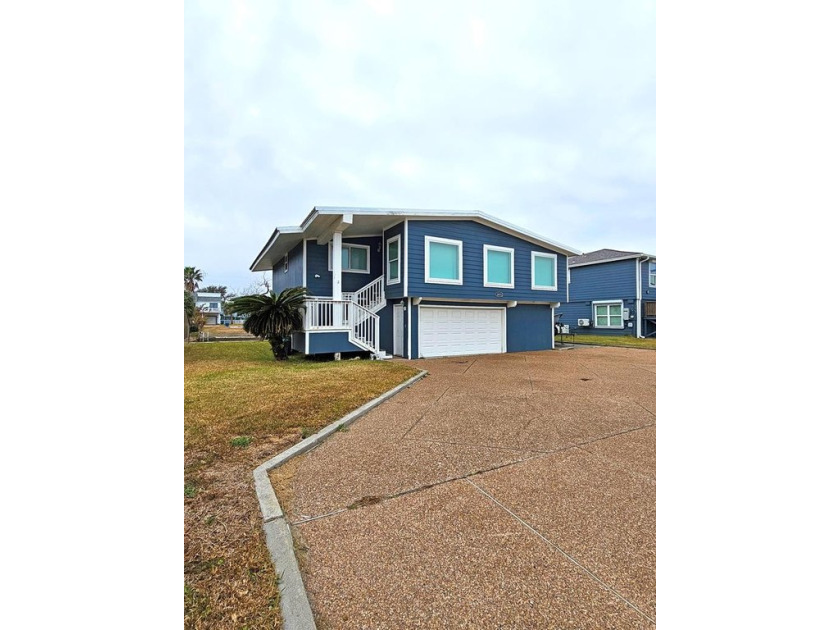 Upstairs and downstairs living at its best on this canal front - Beach Home for sale in Rockport, Texas on Beachhouse.com