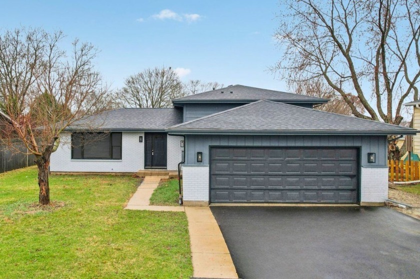 This fully upgraded quad-level home delivers massive value with - Beach Home for sale in Winthrop Harbor, Illinois on Beachhouse.com