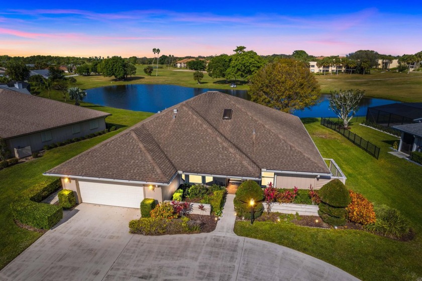 Step into this charming 3-bedroom, 2-bath home with a 2-car - Beach Home for sale in Hobe Sound, Florida on Beachhouse.com