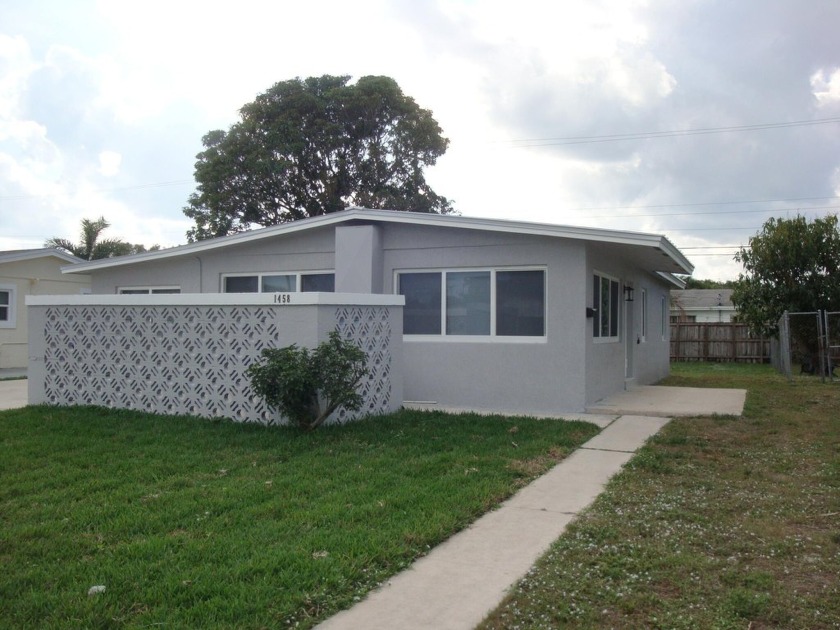 NO HOA! MODERN 4 BEDROOMS 2 BATHS RENOVATED HOME IN THE HEART OF - Beach Home for sale in West Palm Beach, Florida on Beachhouse.com