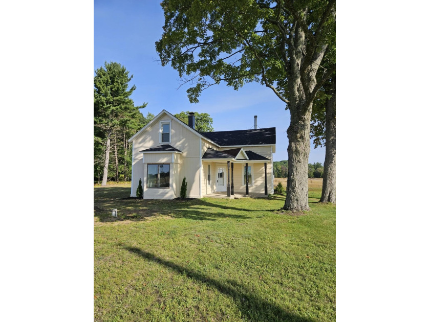 This classic 3-bedroom, 1-bath farmhouse is being completely - Beach Home for sale in Manistee, Michigan on Beachhouse.com