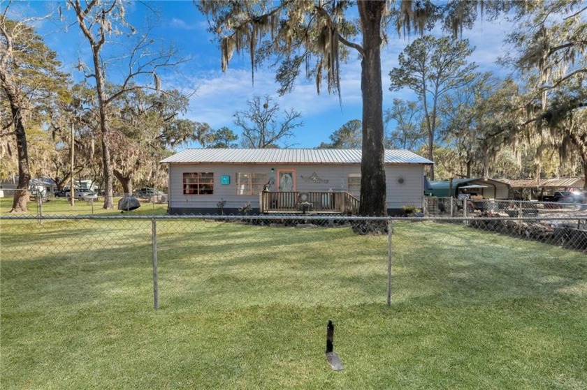 Welcome to your coastal oasis at Shellman Bluff! This unique and - Beach Home for sale in Shellman Bluff, Georgia on Beachhouse.com