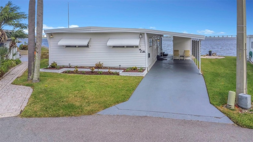 Experience serene waterfront living in this beautifully - Beach Home for sale in Clearwater, Florida on Beachhouse.com