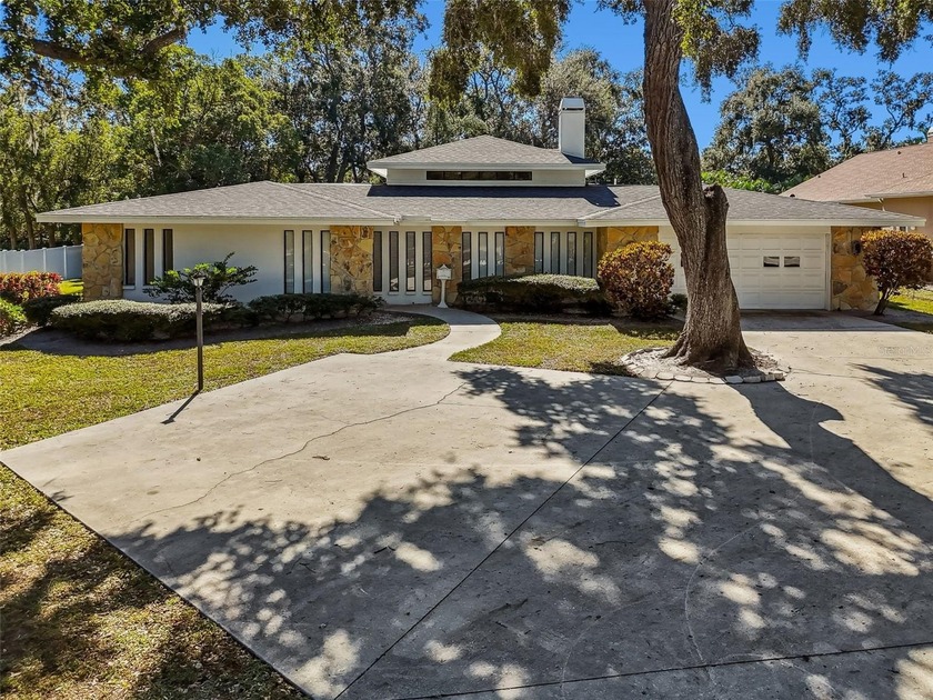 Set on an impressive .68 acre lot in a quiet Clearwater - Beach Home for sale in Clearwater, Florida on Beachhouse.com