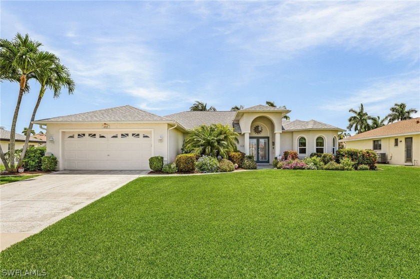 This BEAUTIFULLY landscaped GULF ACCESS POOL home located in the - Beach Home for sale in Cape Coral, Florida on Beachhouse.com