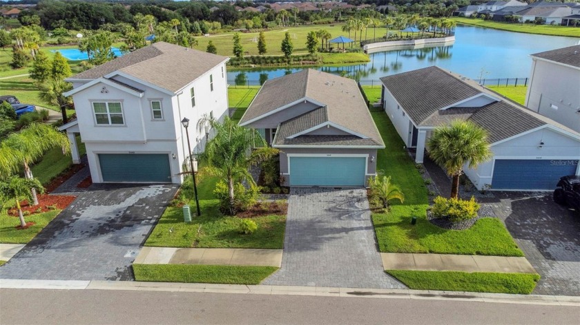 Welcome to this 2021 dream home in the haven of Artisan Lakes - Beach Home for sale in Palmetto, Florida on Beachhouse.com