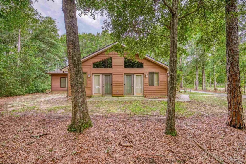 Nestled on a serene 1-acre lot in Milton, this custom-built gem - Beach Home for sale in Milton, Florida on Beachhouse.com