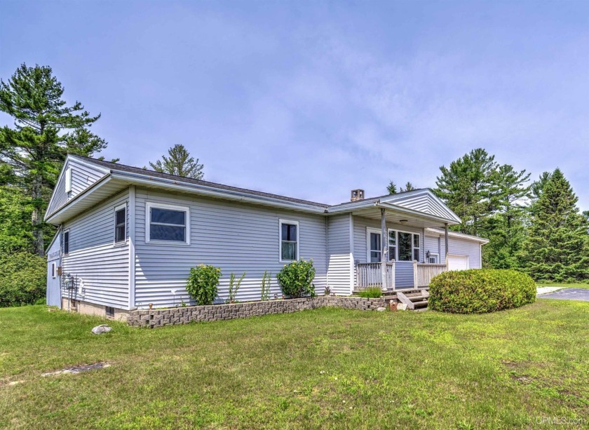 Discover the perfect blend of mid-century charm and convenience - Beach Home for sale in Manistique, Michigan on Beachhouse.com