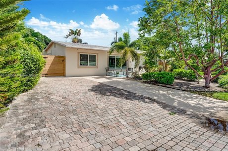 Live the ultimate Florida lifestyle in this unique oasis located - Beach Home for sale in Pompano Beach, Florida on Beachhouse.com