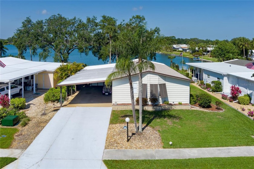 This beautifully updated lakefront retreat with a private dock - Beach Home for sale in Palmetto, Florida on Beachhouse.com