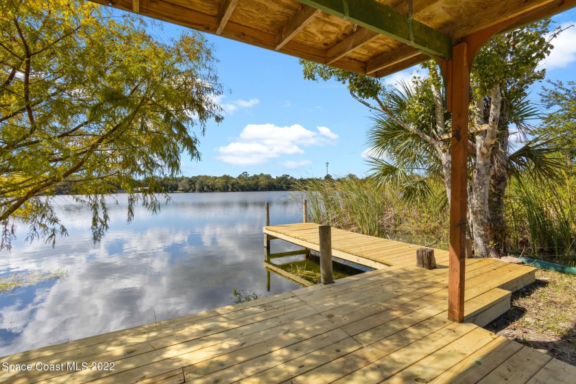 This beautifully remodeled home sits on a 13 acre lake with a - Beach Home for sale in Mims, Florida on Beachhouse.com