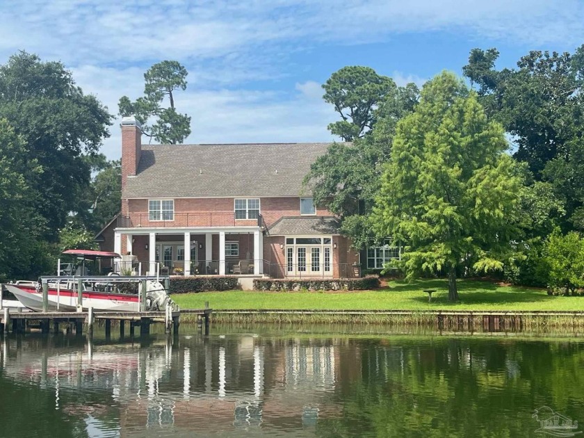 18 Lakeside Dr - Southern-Inspired Waterfront Retreat: Nestled - Beach Home for sale in Pensacola, Florida on Beachhouse.com