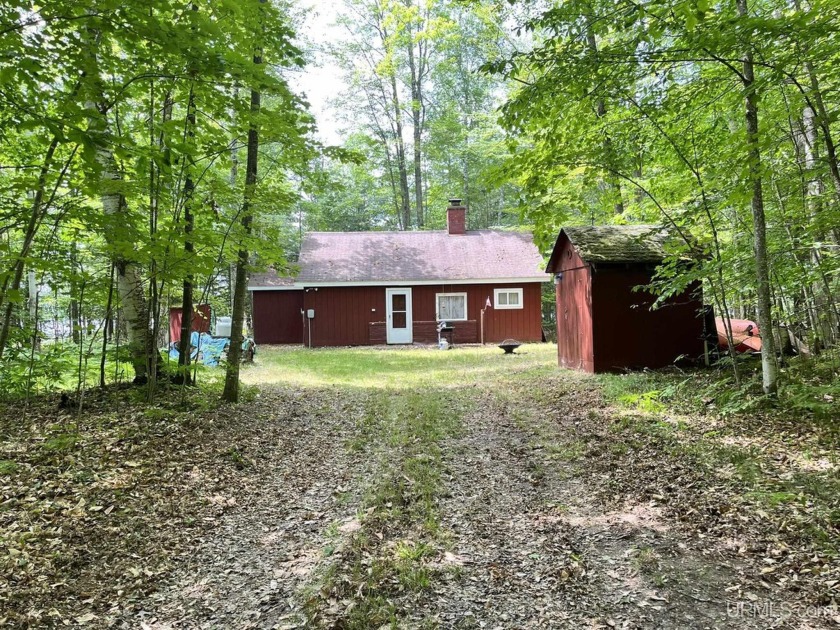 Escape to your own secluded retreat at Steuben Lake with this - Beach Home for sale in Manistique, Michigan on Beachhouse.com