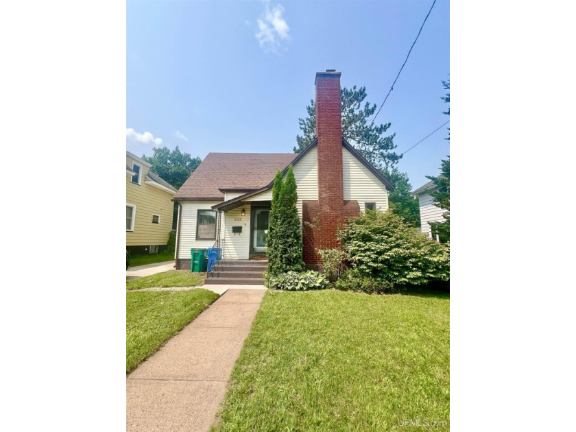 Step into this delightful 3-bedroom, 2-bath home located in - Beach Home for sale in Marquette, Michigan on Beachhouse.com