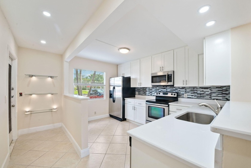 Rarely available first-floor corner unit in the highly - Beach Condo for sale in Boca Raton, Florida on Beachhouse.com