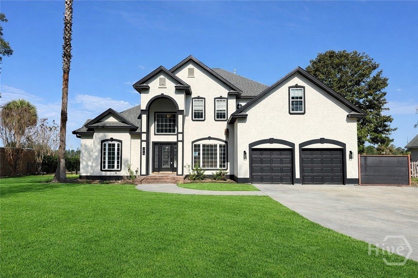 Potential abounds in this 4-bedroom, 2.5-bath home on over 3/4 - Beach Home for sale in Richmond Hill, Georgia on Beachhouse.com