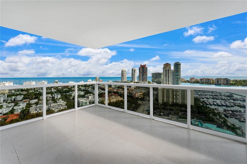 Panoramic water and skyline views define this rare corner - Beach Condo for sale in Miami Beach, Florida on Beachhouse.com