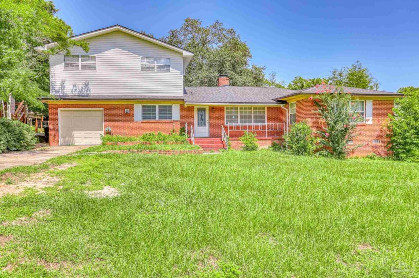 Welcome to this charming home featuring 4 spacious bedrooms and - Beach Home for sale in Pensacola, Florida on Beachhouse.com