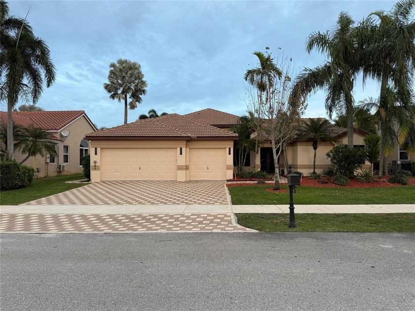 Located on a family friendly street in Forest Ridge, this - Beach Home for sale in Davie, Florida on Beachhouse.com