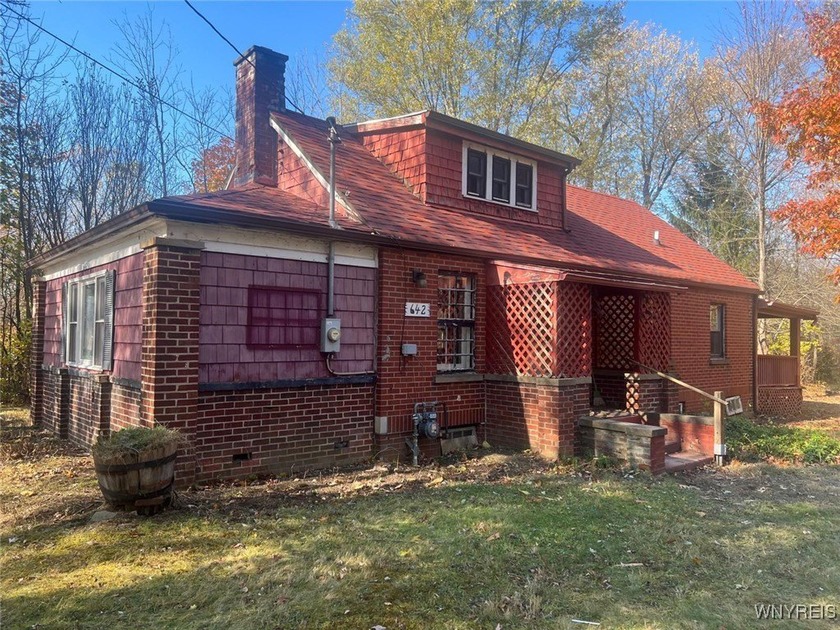 Discover the opportunity to transform this cottage-style home - Beach Home for sale in Angola, New York on Beachhouse.com