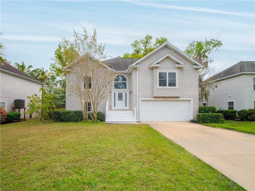 Welcome to a cherished home in the quiet and sought-after Oak - Beach Home for sale in Saint Simons, Georgia on Beachhouse.com