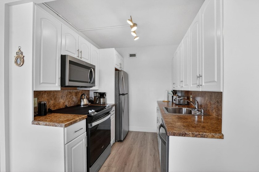 Experience serene living in this desirable fourth-floor - Beach Condo for sale in Boca Raton, Florida on Beachhouse.com