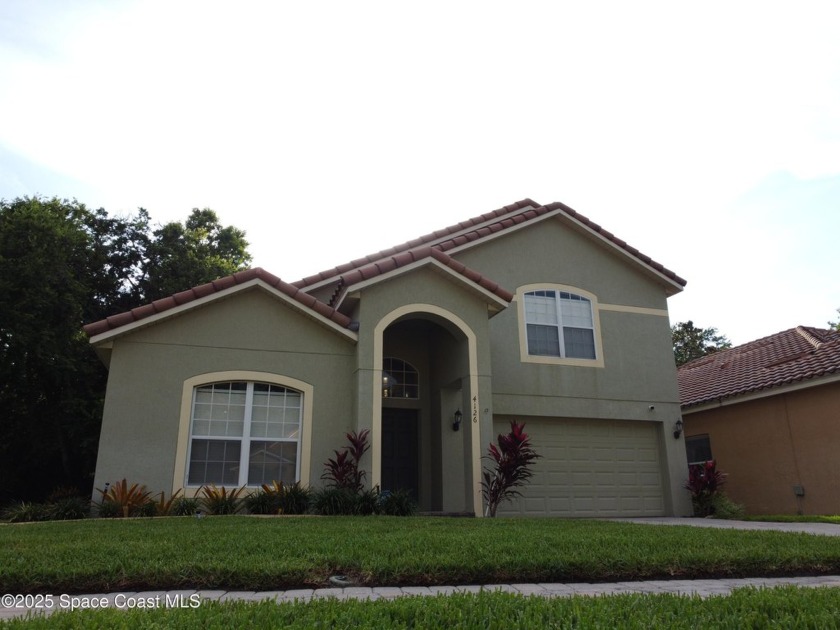 Step into timeless elegance with this Spanish-inspired 4-bedroom - Beach Home for sale in Mims, Florida on Beachhouse.com