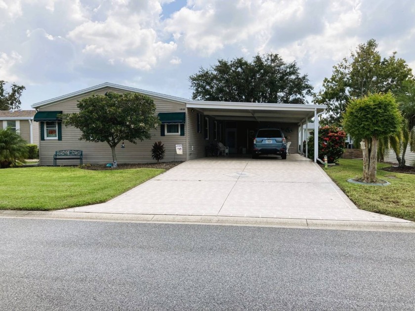 Nestled within the serene Crane Lakes Golf & Country Club, a - Beach Home for sale in Port Orange, Florida on Beachhouse.com