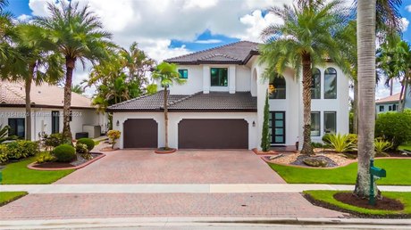 Discover luxury in the exclusive gated community of Sunset Lakes - Beach Home for sale in Miramar, Florida on Beachhouse.com