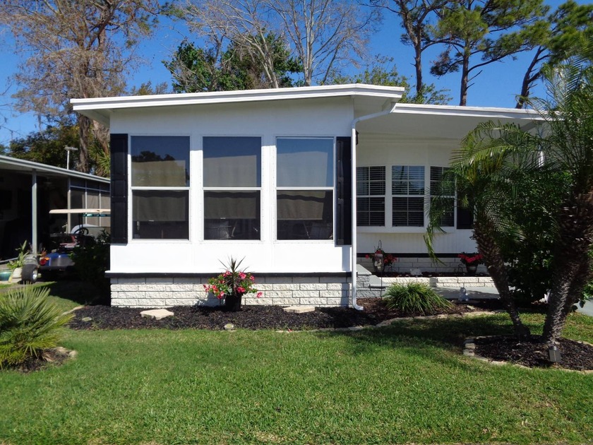 WELCOME HOME TO THIS IMMACULATE FURNISHED HOME, WITH A VIEW OF - Beach Home for sale in New Port Richey, Florida on Beachhouse.com