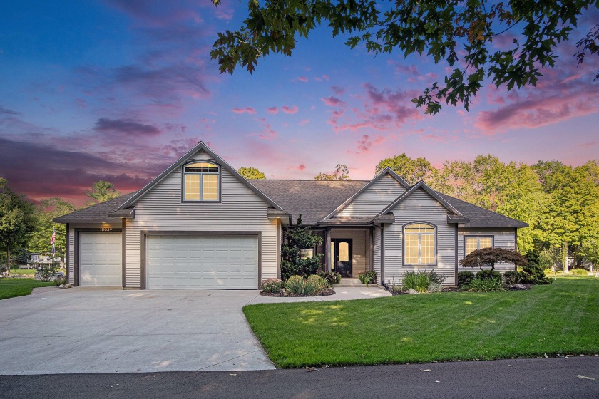 Beautiful updated home situated on 140 ft of private water - Beach Home for sale in Spring Lake, Michigan on Beachhouse.com