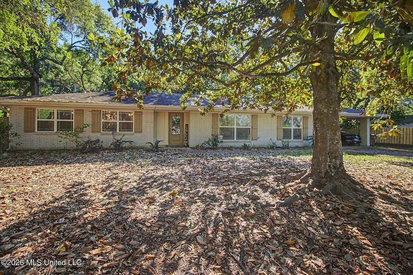 Tucked away on a quiet, tree-lined street, this beautifully - Beach Home for sale in Biloxi, Mississippi on Beachhouse.com
