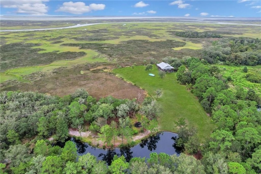 Nestled quietly on 4.35 acres of Coastal Tranquility, this Low - Beach Home for sale in Waverly, Georgia on Beachhouse.com