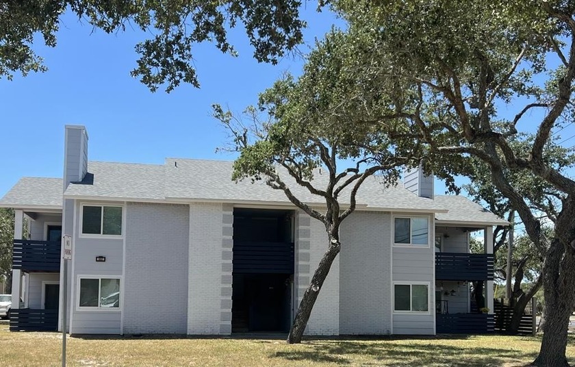 This well-maintained 4-unit building is centrally located in the - Beach Home for sale in Rockport, Texas on Beachhouse.com
