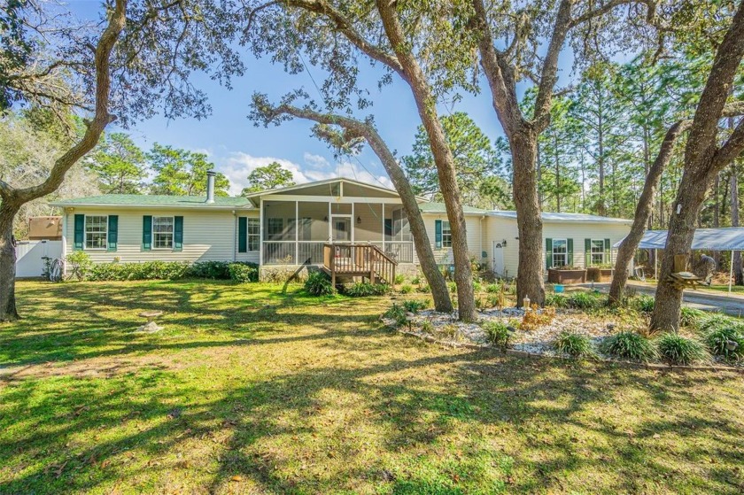 Come Enjoy your own personal OASIS! This 3/2 bath home sits on a - Beach Home for sale in Weeki Wachee, Florida on Beachhouse.com