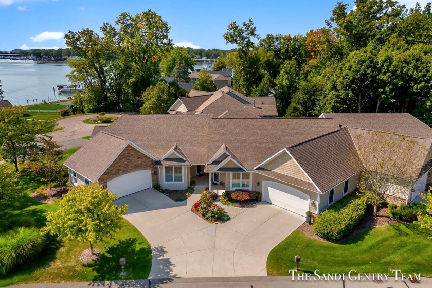 Indulge in luxurious lakeside living with this exquisite Gables - Beach Condo for sale in Spring Lake, Michigan on Beachhouse.com